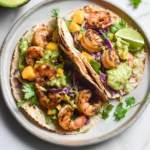 Spicy Shrimp Tacos with Mango Slaw and Avocado Crema
